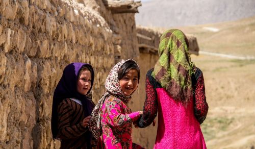 Girls in Afghanistan walk to school in a remote village.