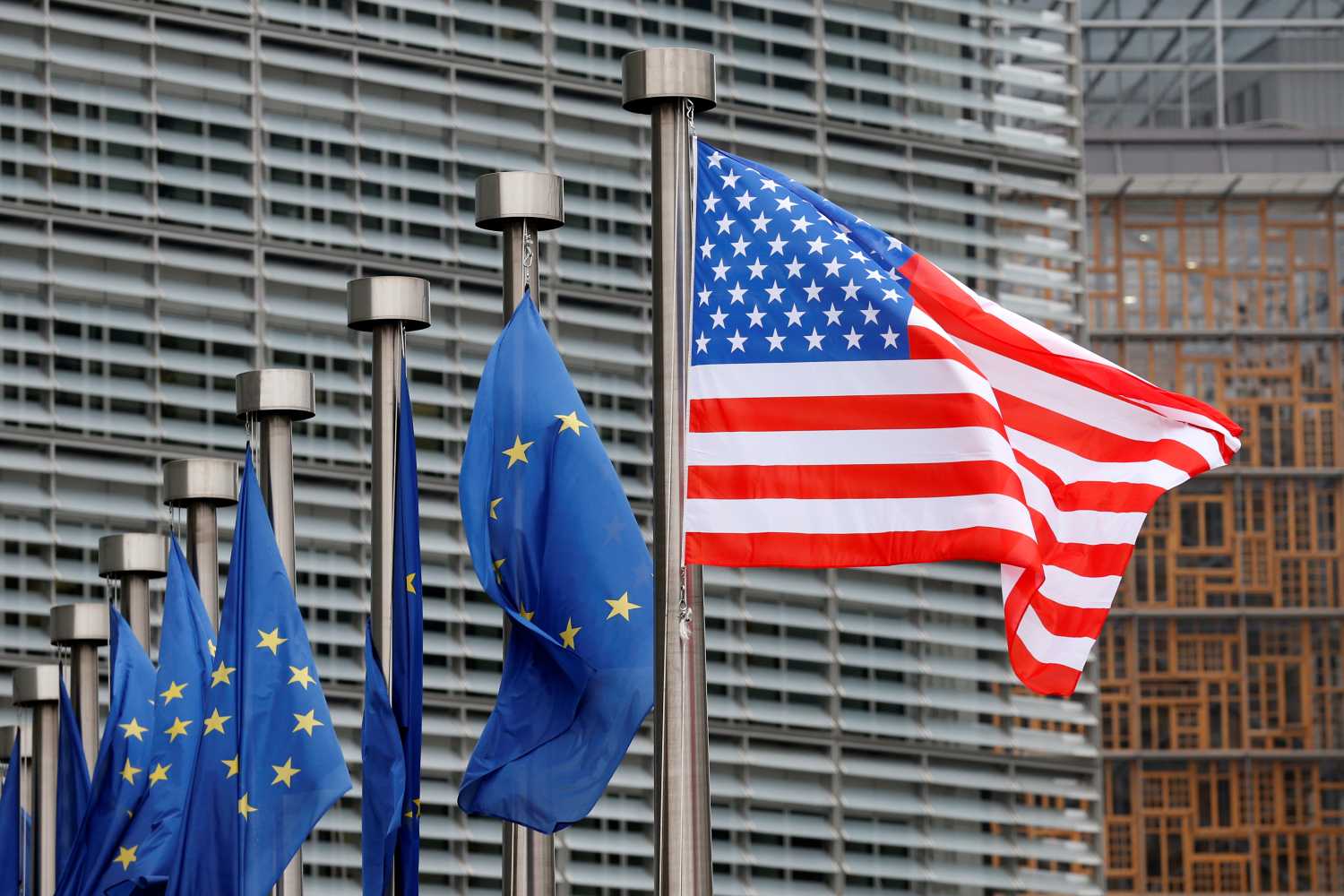 U.S. and European Union flags are pictured during the visit of Vice President Mike Pence to the European Commission headquarters in Brussels, Belgium February 20, 2017. REUTERS/Francois Lenoir