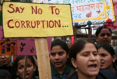 School students shout slogans during a protest against a corruption case in Jammu February 12, 2011. Indian Prime Minister Manmohan Singh faces more political headaches after the Supreme Court pressed for deeper probes into a multi-billion dollar corruption case and a ruling coalition ally was implicated in the scandal. Allegations the government may have lost up to $39 billion in revenues after firms were awarded telecoms deals at rock-bottom prices in return for kickbacks have rocked the ruling coalition and compounded the fragility of India's fragile investment climate. REUTERS/Mukesh Gupta (INDIAN-ADMINISTERED KASHMIR - Tags: CIVIL UNREST POLITICS BUSINESS CRIME LAW)