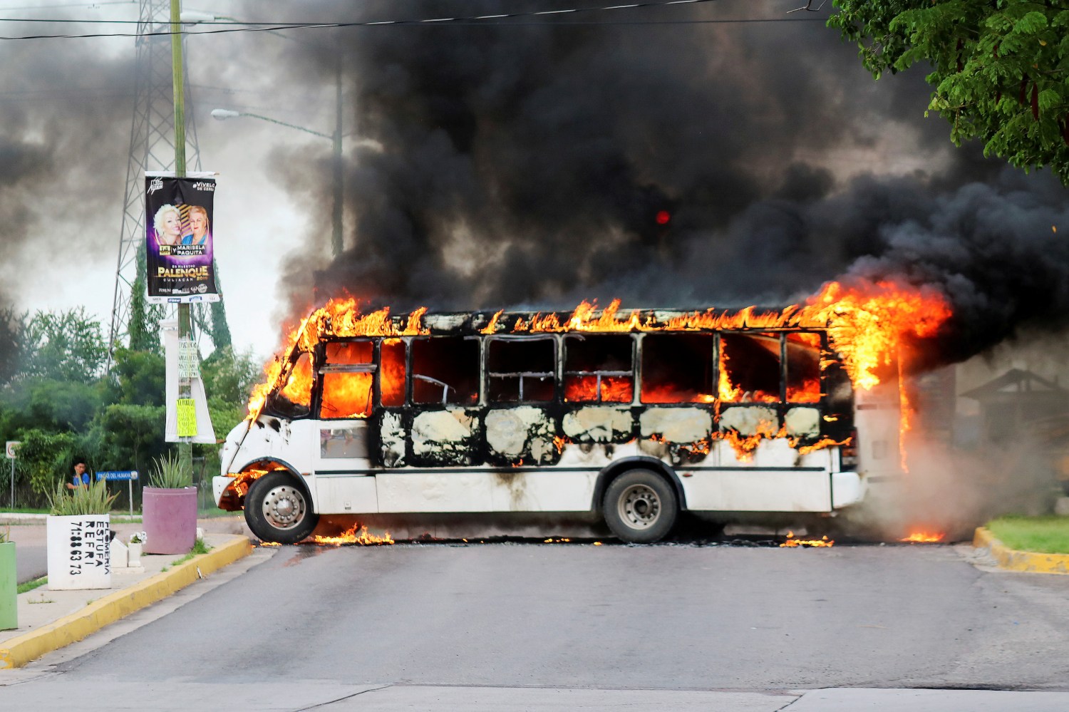 A burning bus, set alight by cartel gunmen to block a road, is pictured during clashes with federal forces following the detention of Ovidio Guzman, son of drug kingpin Joaquin "El Chapo" Guzman, in Culiacan, Sinaloa state, Mexico October 17, 2019. REUTERS/Stringer