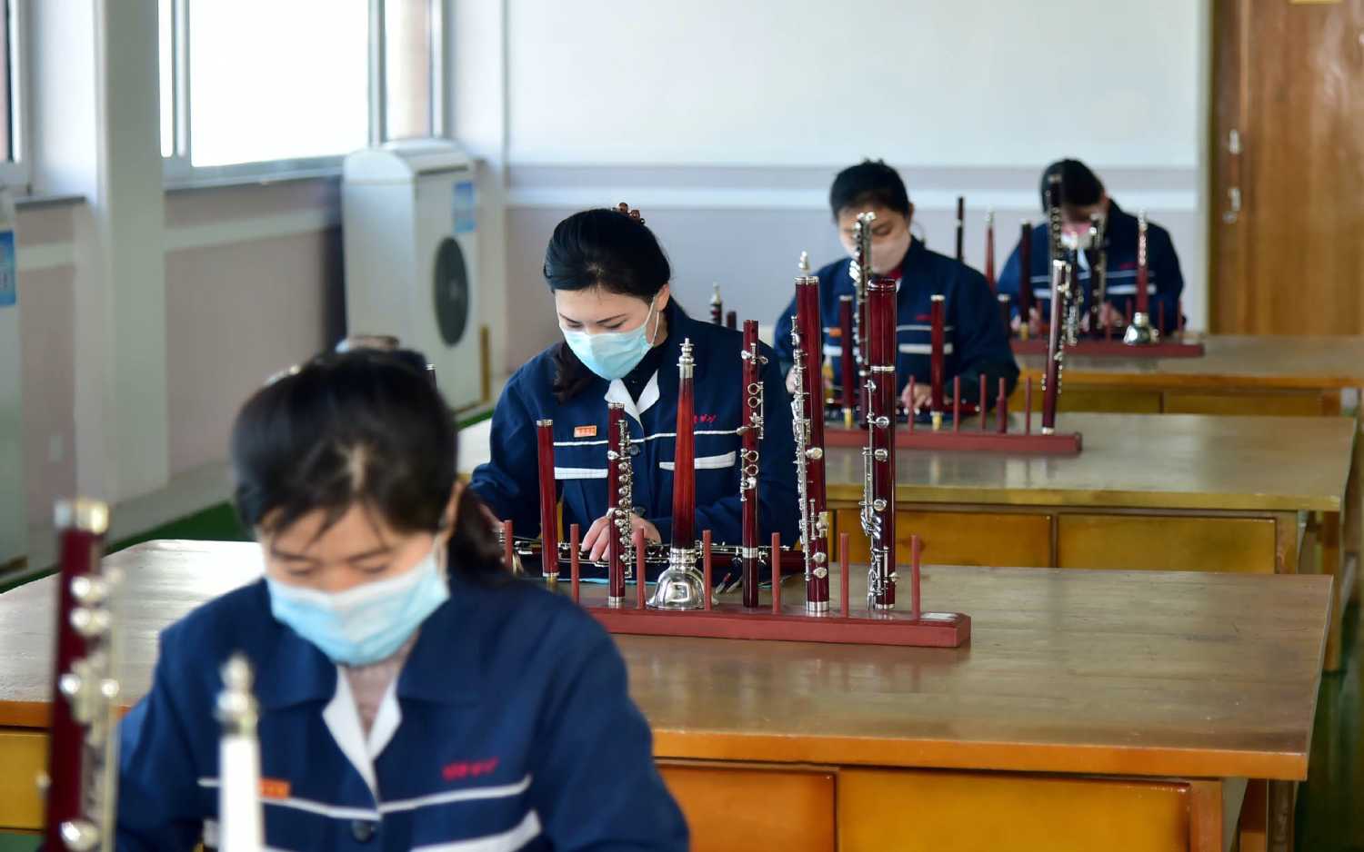 Pyongyang, North Korea - The photo, published on February 2, 2021, by the Choson Sinbo, a pro-North Korean newspaper based in Japan, shows North Korean workers working in a factory of indigenous musical instruments in Pyongyang. The United Nations is concerned about the continuing violation of human rights in North Korea, declared the UN High Commissioner for Human Rights (Acnudh), Michelle Bachelet.