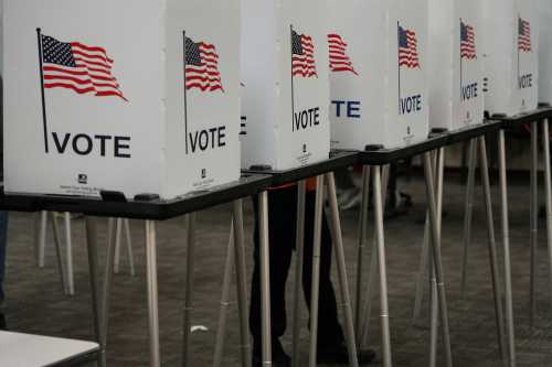 FILE PHOTO: Voting booths are pictured inside the Dona Ana County Government Center during early voting for the upcoming midterm elections in Las Cruces, New Mexico, U.S., October 24, 2022.  REUTERS/Paul Ratje/File Photo