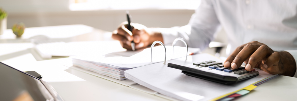 African American Accountant Doing Accounting And Tax