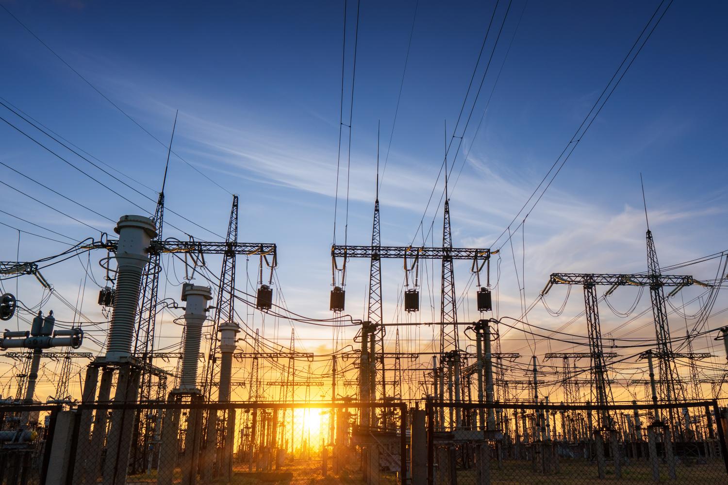 Power,Line,Pylons,During,Sunset,With,Beautiful,Saturated,Sky.,Distribution,