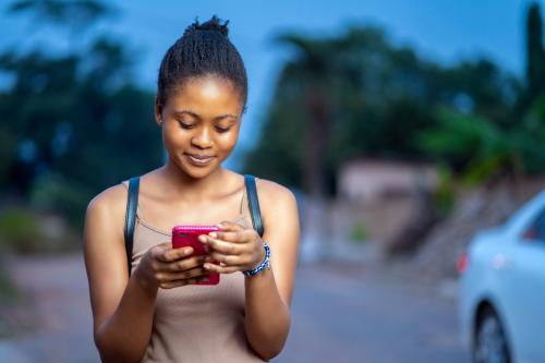 Young woman looking at cell phone