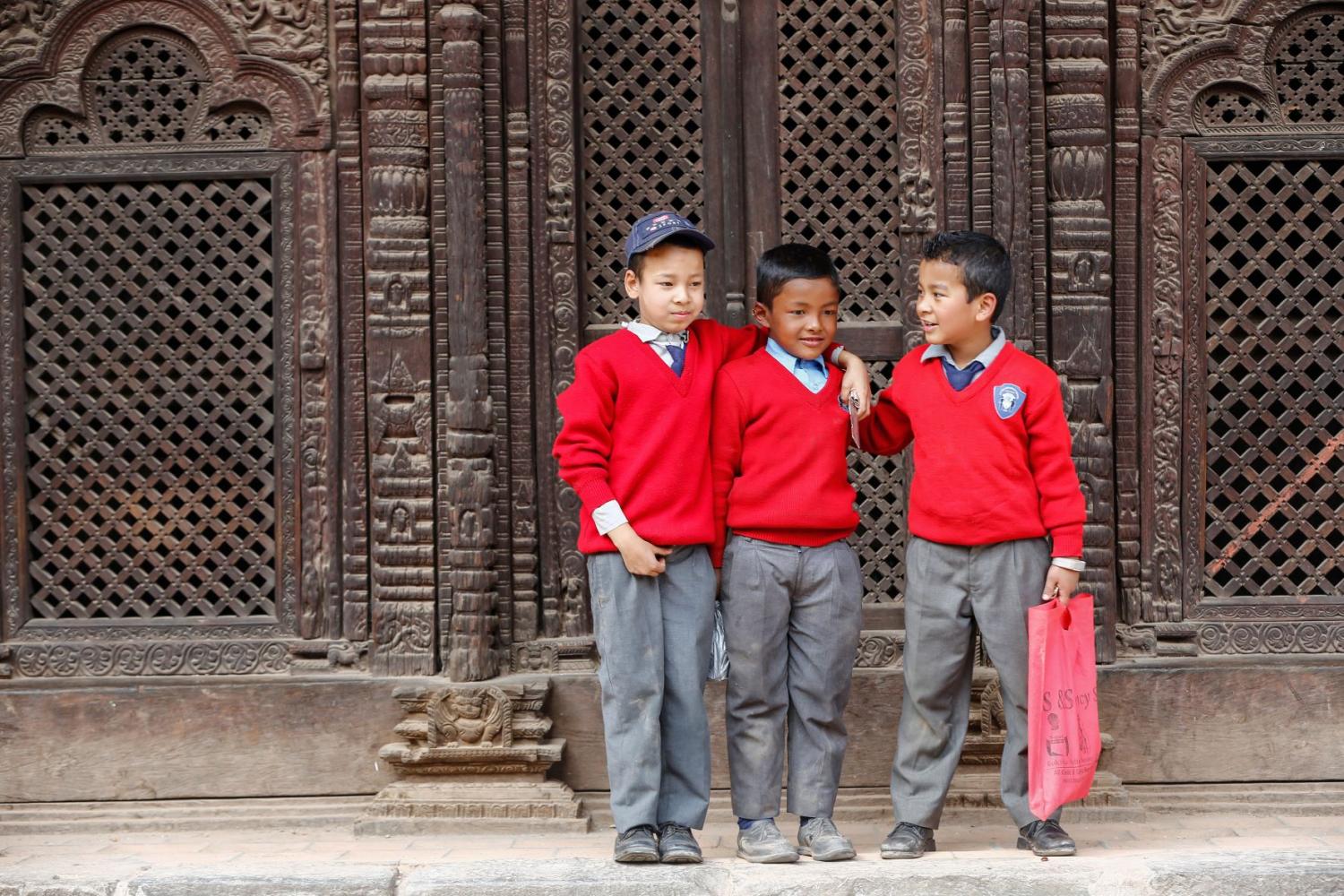 Kids standing outside school