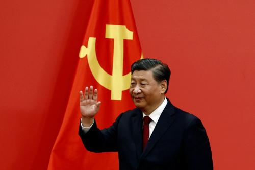 Chinese President Xi Jinping waves after his speech as the new Politburo Standing Committee members meet the media following the 20th National Congress of the Communist Party of China, at the Great Hall of the People in Beijing, China October 23, 2022. REUTERS/Tingshu Wang