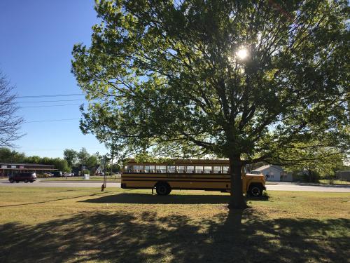 A Newcastle Public Schools bus is seen parked in Newcastle, Oklahoma April 6, 2016.  The Newcastle schools are planning to reduce the school week to four days next year as a result of a nearly $1 million budget cut.   REUTERS/Luc Cohen