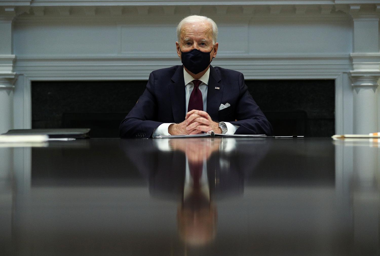 U.S. President Joe Biden receives an economic briefing in the Roosevelt Room at the White House in Washington, U.S., March 5, 2021. REUTERS/Tom Brenner