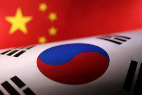 Printed Chinese and South Korean flags are seen in this illustration, July 21, 2022. REUTERS/Dado Ruvic/Illustration REFILE - CORRECTING YEAR