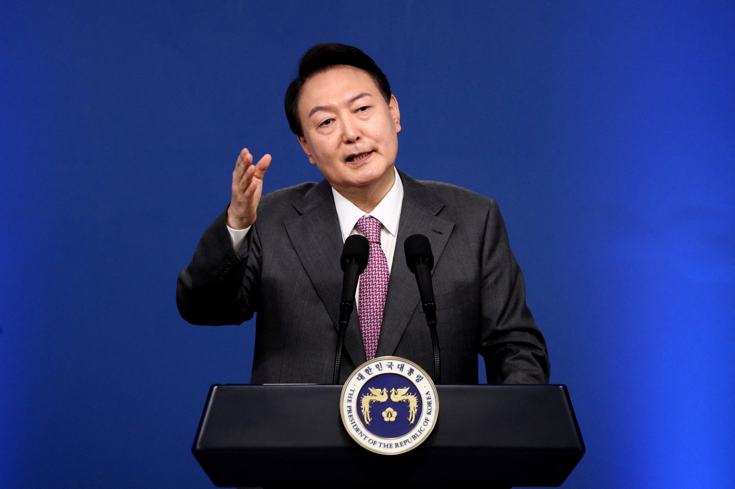 South Korea's President Yoon Suk-yeol gestures as he holds his first official news conference, after taking office in May, to mark 100 days in office, in Seoul, South Korea August 17, 2022. Chung Sung-Jun/Pool via REUTERS