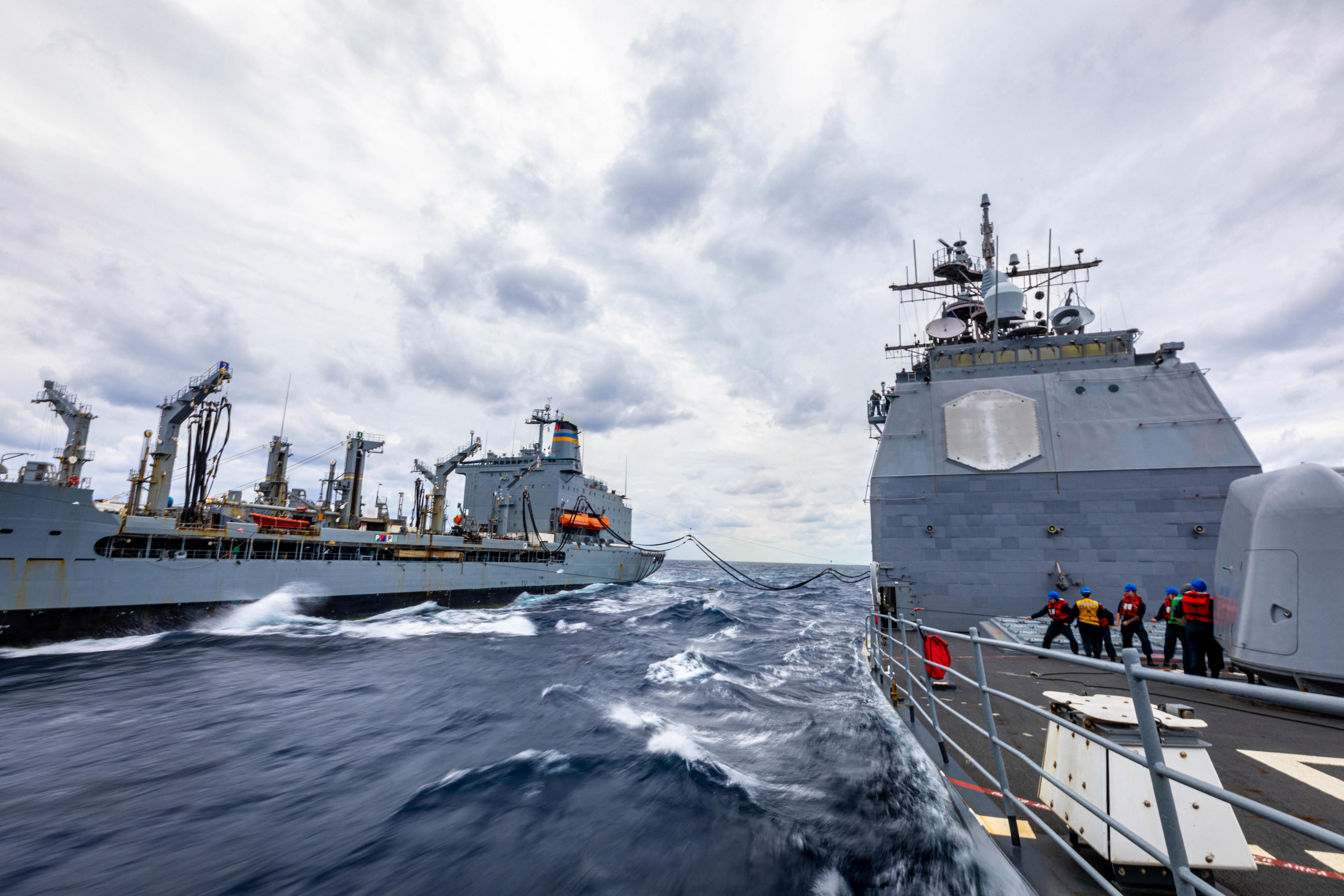 Handout photo dated October 28 2022 of the Ticonderoga-class guided-missile cruiser USS Chancellorsville (CG 62) conducts a replenishment-at-sea with the Military Sealift Command Henry J. Kaiser-class underway replenishment oiler USNS Yukon (T-AO-202) in the Philippine Sea. Chancellorsville is forward-deployed to the U.S. 7th Fleet in support of security and stability in the Indo-Pacific and is assigned to Commander, Task Force 70, a combat-ready force that protects and defends the collective maritime interest of its allies and partners in the region. U.S. Navy photo by Mass Communication Specialist 2nd Class Justin Stack via ABACAPRESS.COM
