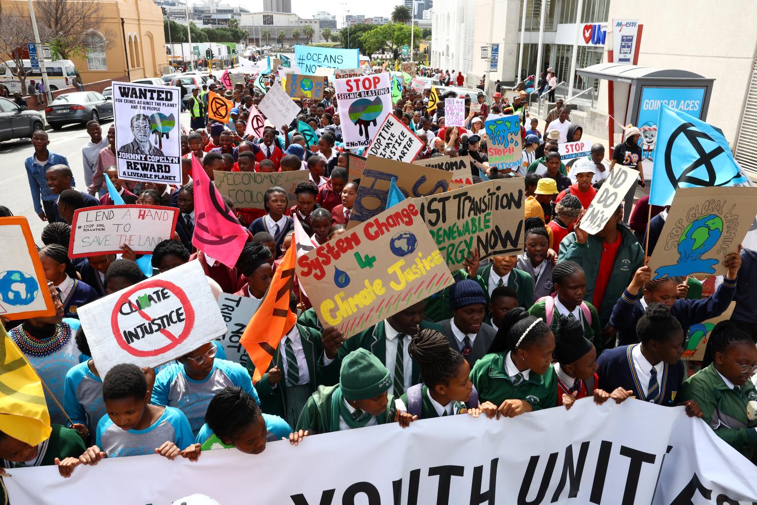 Environmental activists carrying placards take part during Global Climate Strike, in Cape Town, South Africa, September 24, 2022. REUTERS/Esa Alexander