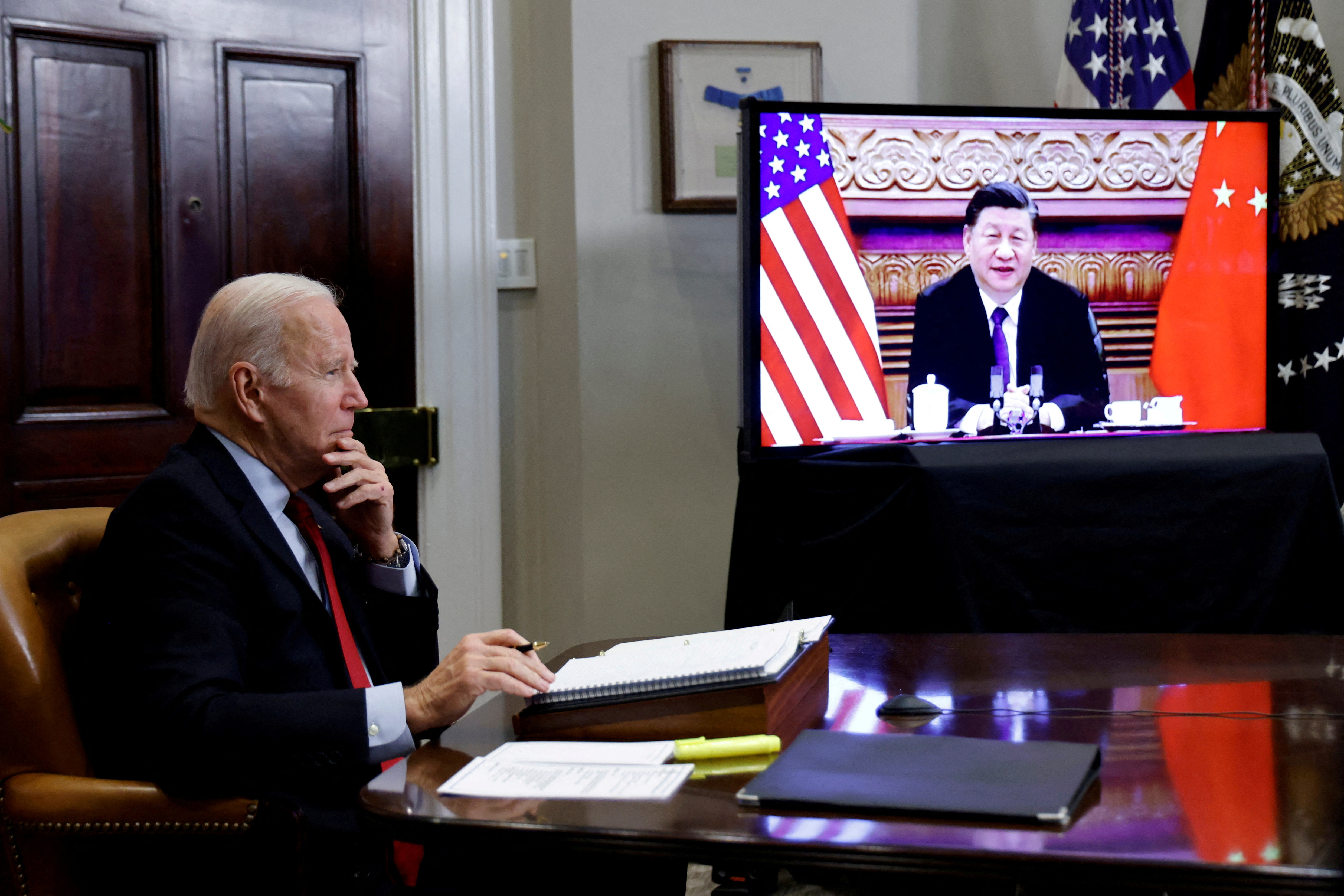 FILE PHOTO: U.S. President Joe Biden speaks virtually with Chinese leader Xi Jinping from the White House in Washington, U.S. November 15, 2021.  REUTERS/Jonathan Ernst//File Photo