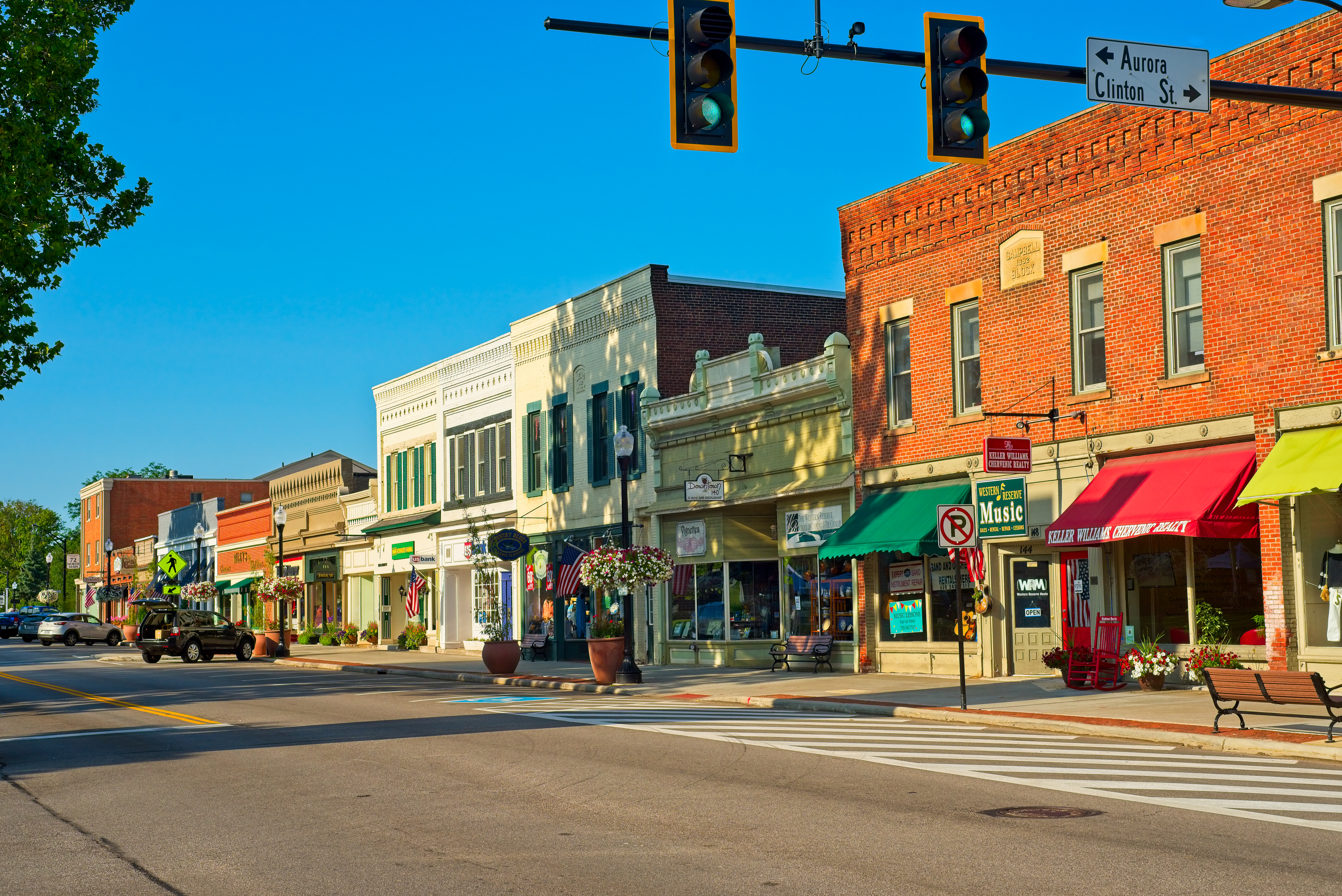 HUDSON, OH - JULY 28, 2018: A view along North Main Street with shops, cafes, and businesses as the charming small town comes to life on a sunny Saturday morning in northeast Ohio.