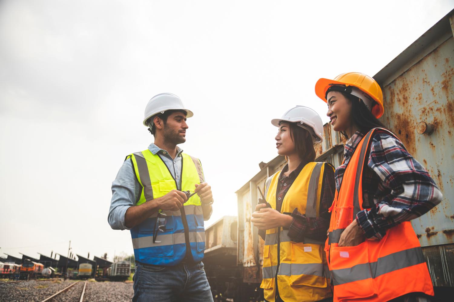 Team engineers are on duty and discussed in the job site of train garage