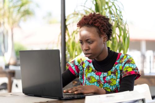 Young African woman working at a computer