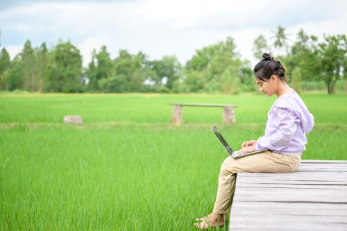 girl using computer rural