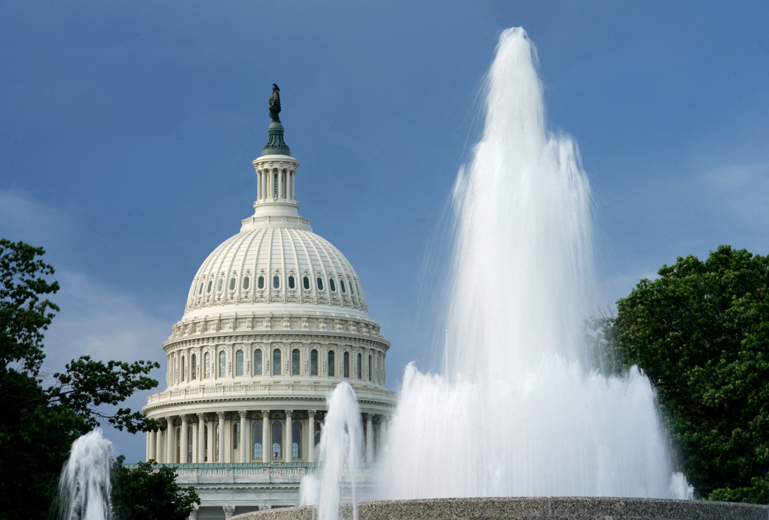 FILE PHOTO: The dome of the U.S. Capitol is seen beyond a fountain on the day the House of Representatives returns from its August recess to vote on the Senate-passed H.R. 6376, the "Inflation Reduction Act of 2022" in Washington, U.S., August 12, 2022. REUTERS/Kevin Lamarque/File Photo