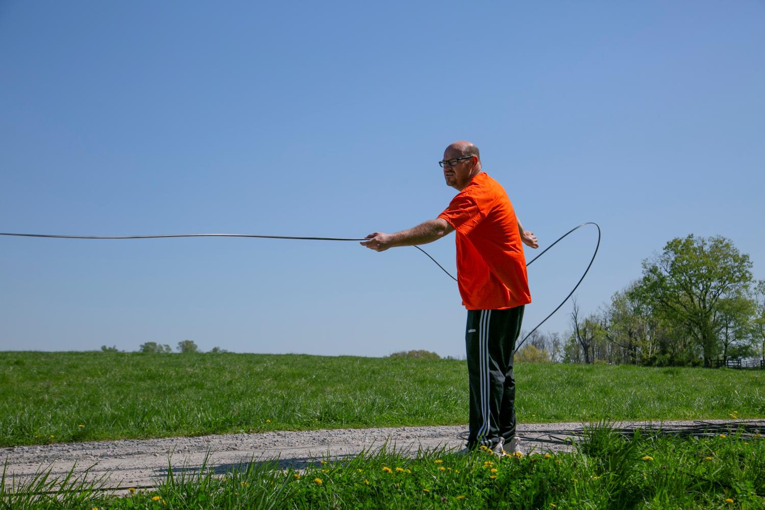 Dave Wallace, owner of Silica Broadband, installs fiber internet in Louisville, Kentucky, U.S., April 19, 2021.  REUTERS/Amira Karaoud