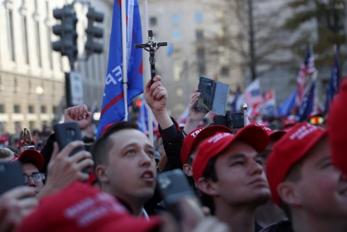 Supporters of the America First ideology and U.S. President Donald Trump listen to Nick Fuentes, a leader of the America First movement and a white nationalist, as they participate in a "Stop the Steal" and "Million MAGA March" protests after the 2020 U.S. presidential election was called for Democratic candidate Joe Biden, in Washington, U.S. November 14, 2020. Picture taken November 14, 2020. REUTERS/Leah Millis