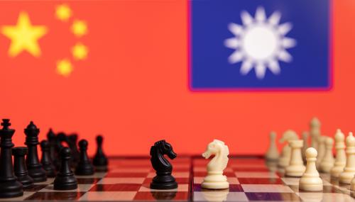 Chess pieces are seen in front of displayed China and Taiwan's flags in this illustration taken January 25, 2022. REUTERS/Dado Ruvic/Illustration