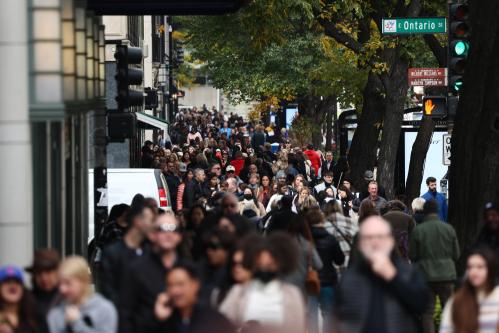 People walk the sidewalk in Chicago, United States on October 14, 2022. (Photo by Jakub Porzycki/NurPhoto)NO USE FRANCE