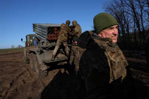 Service members with the Ukrainian Army's 10th Mountain Assault Brigade unit prepare a BM-21 Grad self- propelled multiple rocket launcher, as Russia's attack on Ukraine continues, for launching near the frontlines in the Bakhmut region of Ukraine, December 7, 2022. REUTERS/Shannon Stapleton