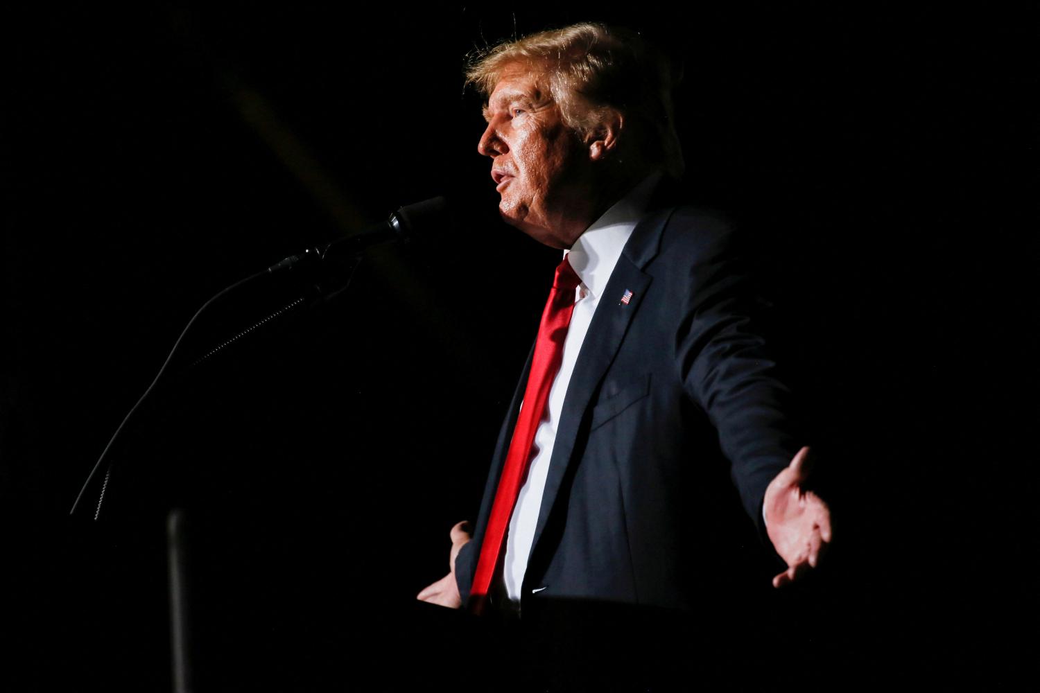 FILE PHOTO: Former U.S. President Donald Trump reacts during his speech during a rally at the Iowa States Fairgrounds in Des Moines, Iowa, U.S., October 9, 2021. REUTERS/Rachel Mummey/File Photo