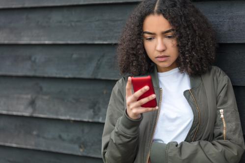 depressed teen with phone