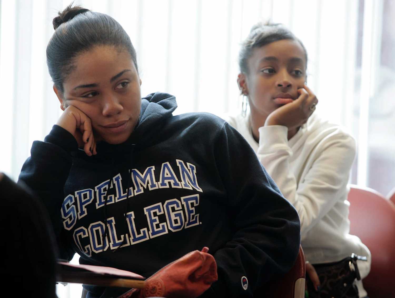 Freshman students Laurah Pollonais and Dalicia Barker listen during a class at Spelman College in Atlanta, Georgia in this picture taken February 12, 2009. Black colleges in the United States are reeling from the impact of a recession that has hit their funding and are struggling to retain poor and middle income students. Picture taken February 12. To match feature USA-UNIVERSITIES/BLACK REUTERS/Tami Chappell (UNITED STATES)