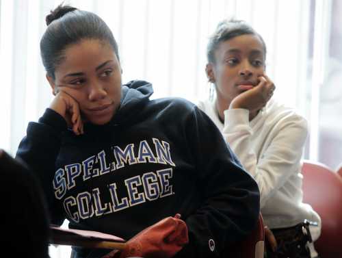 Freshman students Laurah Pollonais and Dalicia Barker listen during a class at Spelman College in Atlanta, Georgia in this picture taken February 12, 2009. Black colleges in the United States are reeling from the impact of a recession that has hit their funding and are struggling to retain poor and middle income students. Picture taken February 12. To match feature USA-UNIVERSITIES/BLACK REUTERS/Tami Chappell (UNITED STATES)
