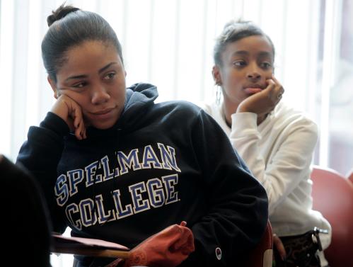 Freshman students Laurah Pollonais and Dalicia Barker listen during a class at Spelman College in Atlanta, Georgia in this picture taken February 12, 2009. Black colleges in the United States are reeling from the impact of a recession that has hit their funding and are struggling to retain poor and middle income students. Picture taken February 12. To match feature USA-UNIVERSITIES/BLACK   REUTERS/Tami Chappell (UNITED STATES)