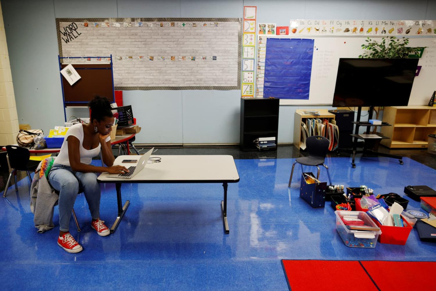 Kindergarten teacher Princess Bryant prepares her classroom, from where she will begin the new school year teaching classes virtually because of the coronavirus disease (COVID-19) pandemic, at the Tynan Elementary School in Boston, Massachusetts, U.S., September 18, 2020. REUTERS/Brian Snyder