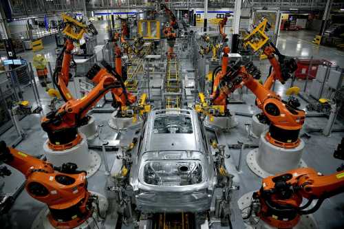 FILE PHOTO: Autonomous robots assemble an X model SUV at the BMW manufacturing facility in Greer, South Carolina, U.S. November 4, 2019. REUTERS/Charles Mostoller/File Photo