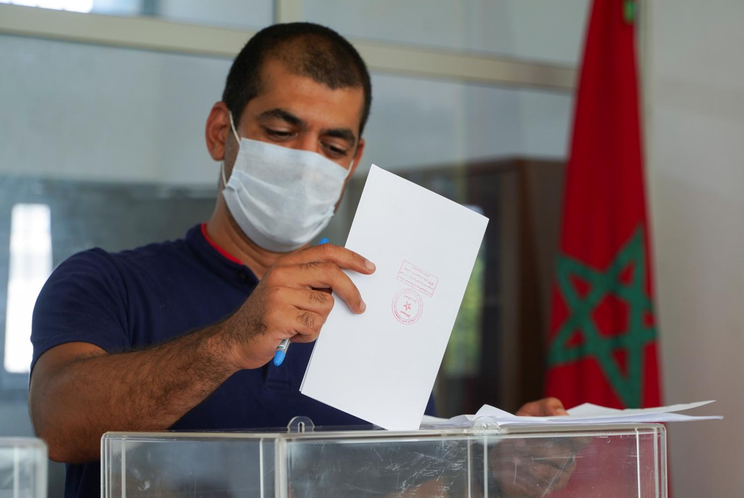 A man casts his vote at a polling station during parliamentary and local elections, in Casablanca, Morocco September 8, 2021. REUTERS/Abdelhak Balhaki