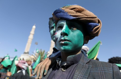 A Houthi supporter with his face painted green and white attends a rally to mark the Prophet Muhammad's birthday in Sanaa, Yemen October 18, 2021. REUTERS/Khaled Abdullah