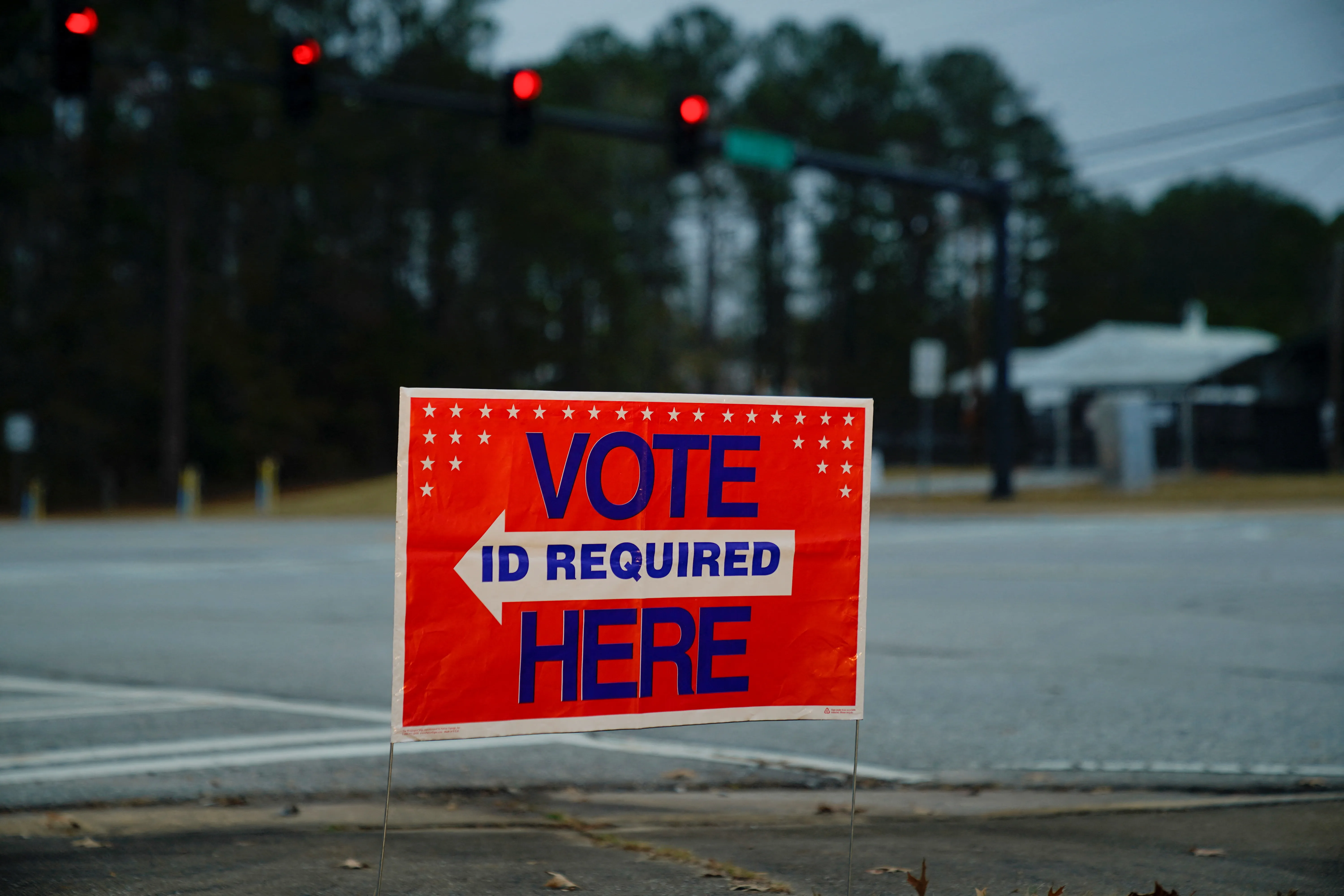 A sign directs voters to a polling location, during the midterm runoff elections in Columbus, Georgia, U.S., December 6, 2022. REUTERS/Cheney Orr