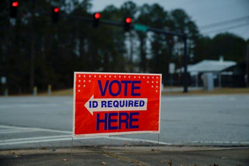 A sign directs voters to a polling location, during the midterm runoff elections in Columbus, Georgia, U.S., December 6, 2022. REUTERS/Cheney Orr