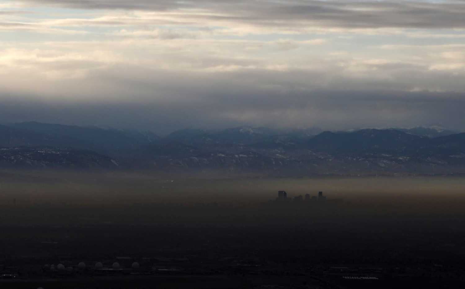 FILE PHOTO: The Rocky Mountains are pictured as a layer of air pollution hangs over Denver, Colorado, U.S. January 21, 2020. Picture taken January 21, 2020. REUTERS/Jim Urquhart/File Photo
