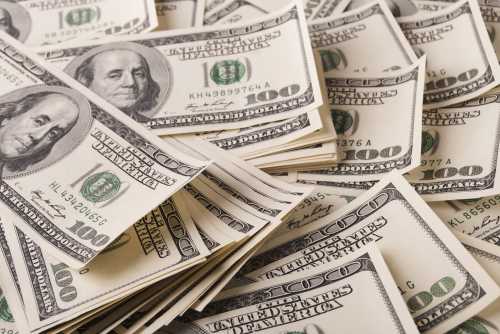 pile of one hundred dollar bills