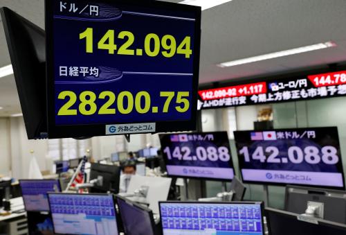 The Japanese yen exchange rate against the U.S. dollar and Nikkei share average are displayed on a monitor inside the dealing room at the foreign exchange trading company Gaitame.com in Tokyo, Japan November 11, 2022. REUTERS/Issei Kato