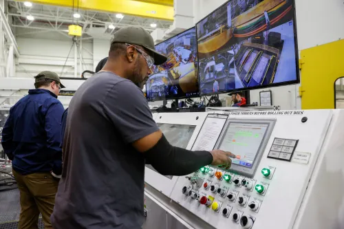 Employees work on an assembly line at startup Rivian Automotive's electric vehicle factory in Normal, Illinois, U.S. April 11, 2022. Picture taken April 11, 2022.  REUTERS/Kamil Krzaczynski