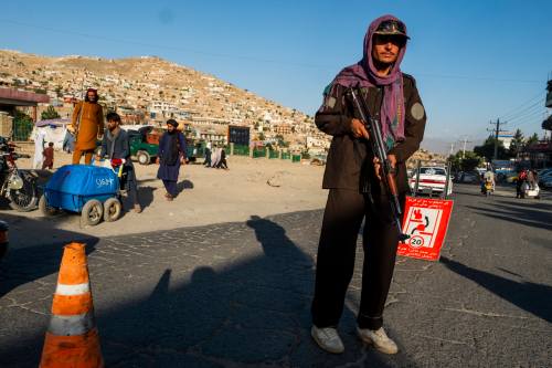 former Taliban fighter wearing new police uniform, Taliban fighters now have new jobs manning checkpoints on the streets and carrying out security patrols in the Kabul city. The Taliban issued new uniforms for the Islamic Emirate of Afghanistan, police force, after months without an official attire. The biggest changes to the gear include shifting the colour to dark brown and replacing the Afghanistan tricoloured republican flag with the Taliban’s white one. Its roll-out started with 20,000 uniforms mainly in the capital Kabul and Kandahar province. Kabul, Afghanistan, July 22, 2022. Photo by Alfred Yaghobzadeh/ABACAPRESS.COM