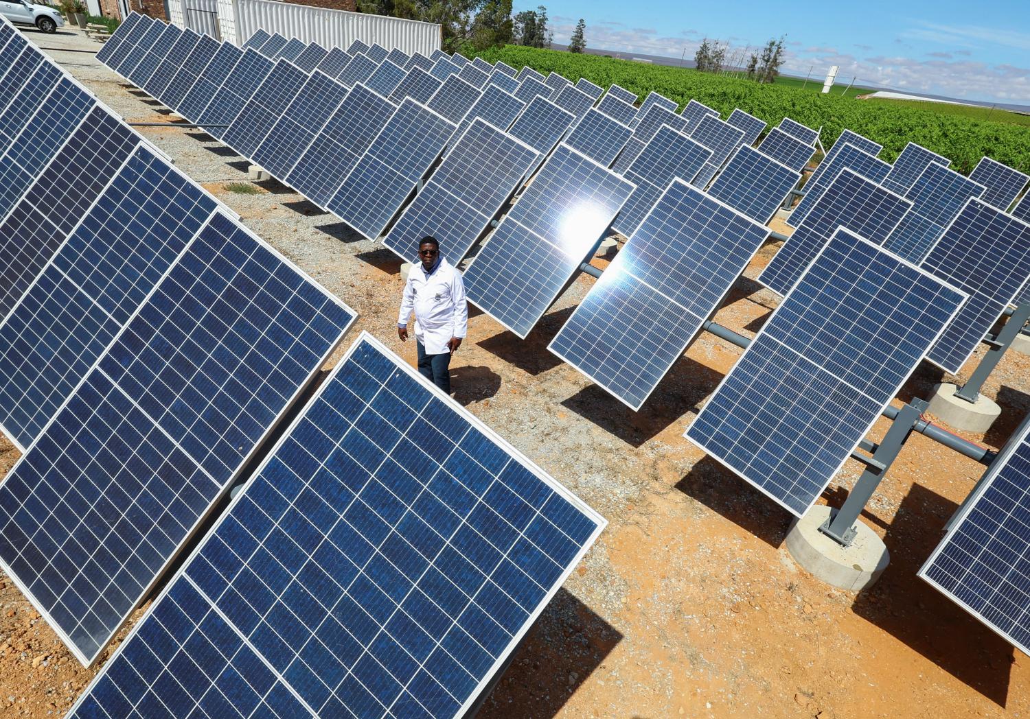 Dr Stanford Chidziva, acting director of Green Hydrogen, looks at the solar panels at the site where Keren Energy constructed the first proof of concept of green hydrogen production facility in Africa at Namaqua Engineering in Vredendal, in collaboration with The Green Hydrogen Institute for Advanced Materials Chemistry (SAIAMC) at the University of the Western Cape, South Africa, November 15, 2022. REUTERS/Esa Alexander