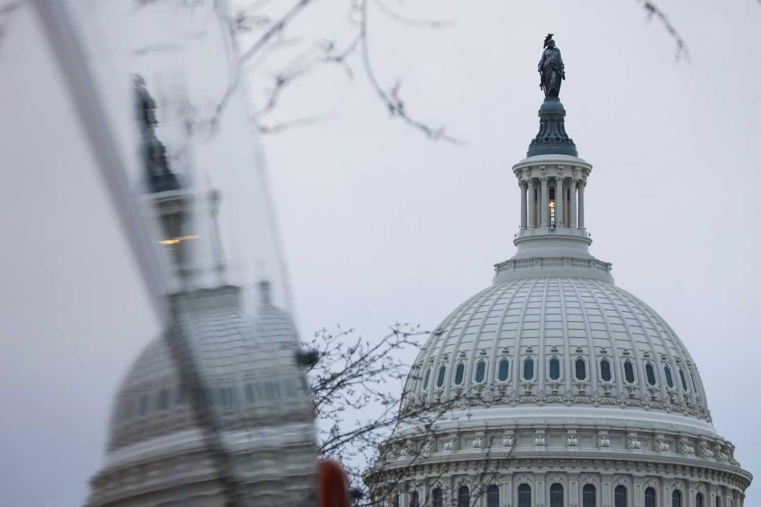 The dome of the U.S. Capitol building is reflected on a bus on the day of U.S. President Joe Biden's State of the Union Address to a joint session of Congress on Capitol Hill in Washington, U.S., February 7, 2023. REUTERS/Amanda Andrade-Rhoades