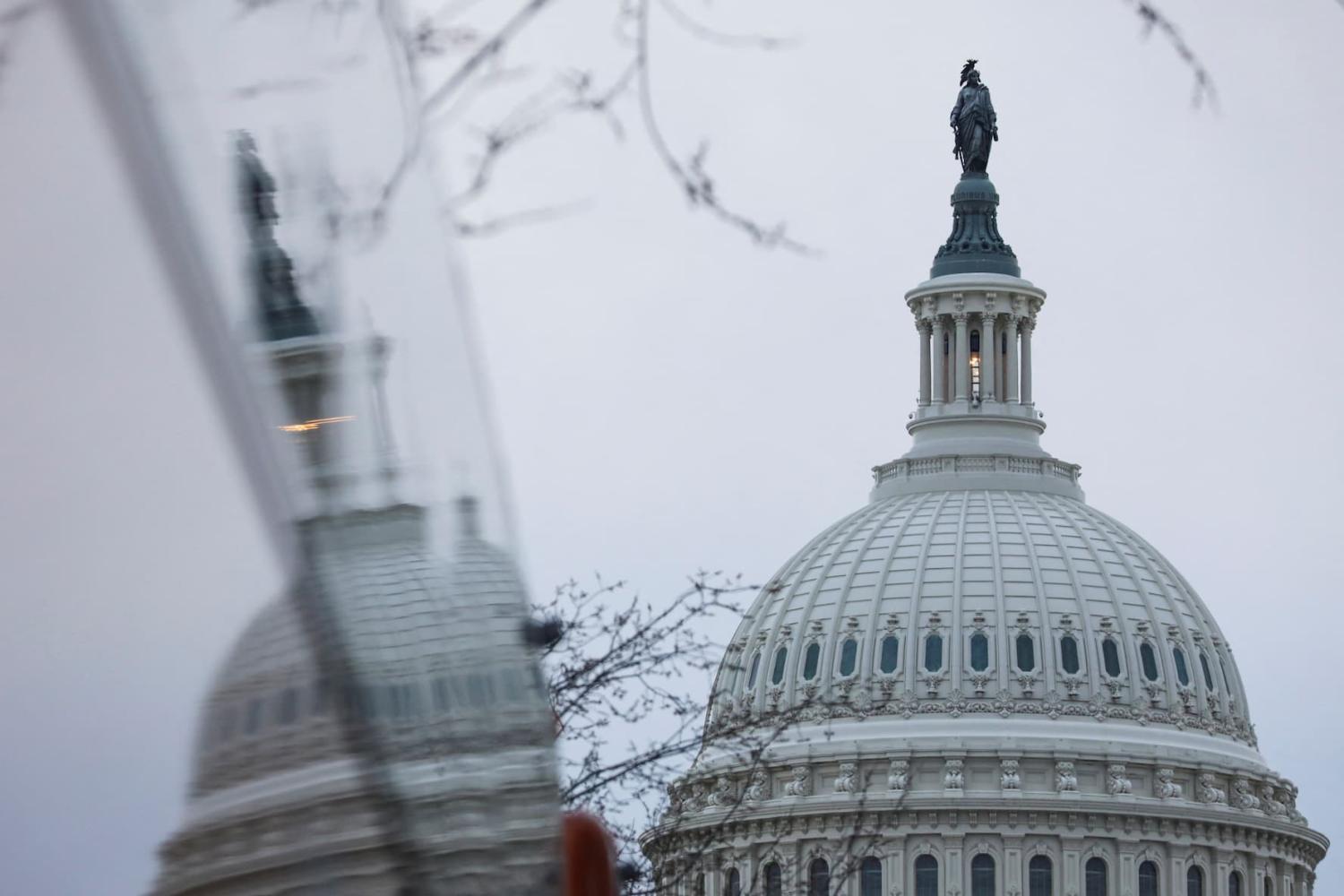 The dome of the U.S. Capitol building is reflected on a bus on the day of U.S. President Joe Biden's State of the Union Address to a joint session of Congress on Capitol Hill in Washington, U.S., February 7, 2023. REUTERS/Amanda Andrade-Rhoades