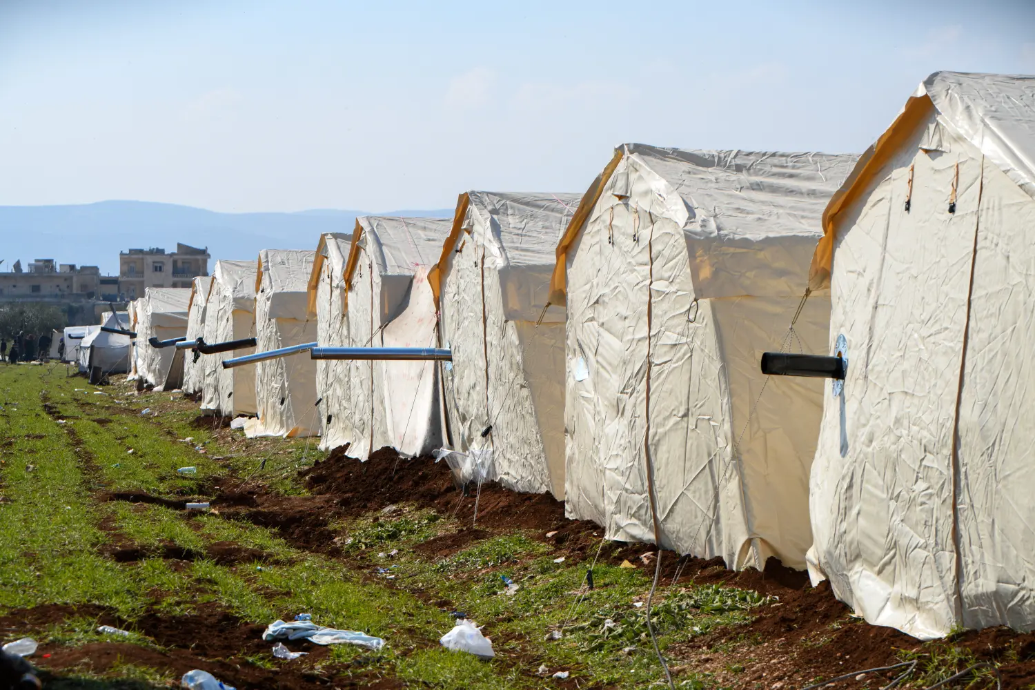 Displaced people from the earthquake in shelters and temporary camps on the outskirts of Jenderes, northwest Syria, on February 13, 2023.