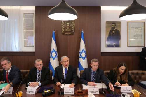 Israeli Prime Minister Benjamin Netanyahu, Justice Minister Yariv Levin, Foreign Minister Eli Cohen  and cabinet secretary Yossi Fuchs attend the weekly cabinet meeting in the prime minister's office Jerusalem, February 19, 2023. Abir Sultan/Pool via REUTERS