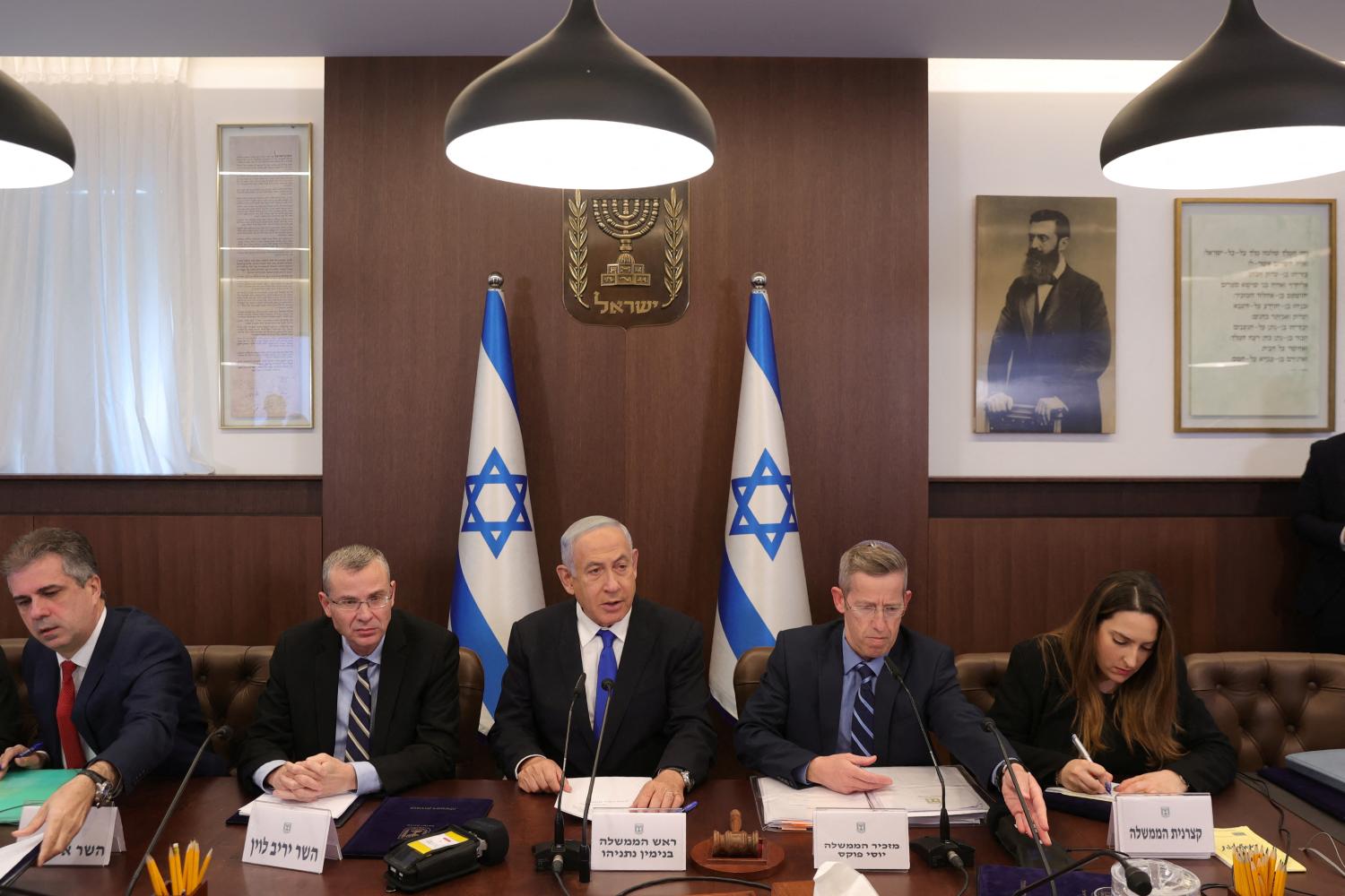 Israeli Prime Minister Benjamin Netanyahu, Justice Minister Yariv Levin, Foreign Minister Eli Cohen  and cabinet secretary Yossi Fuchs attend the weekly cabinet meeting in the prime minister's office Jerusalem, February 19, 2023. Abir Sultan/Pool via REUTERS